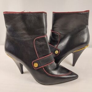 Chic Black Heeled Boots with Gold Detail